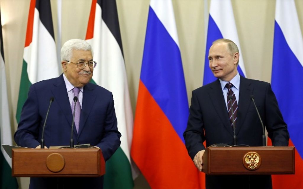 Russian President Vladimir Putin (R) and Palestinian leader Mahmoud Abbas take part in a videoconference with Bethlehem following a meeting at the Bocharov Ruchei residence in the Black Sea resort of Sochi on May 11, 2017. / AFP PHOTO / POOL / YURI KOCHETKOV