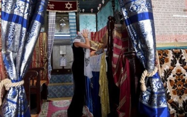 A French pilgrim prays at the Ghriba synagogue in the Tunisian resort island of Djerba on May 12, 2017 during the first day of the annual Jewish pilgrimage to the synagogue on Tunisia's Mediterranean resort island of Djerba. (Fethi Belad/AFP) A French pilgrim prays at the Ghriba synagogue in the Tunisian resort island of Djerba on May 12, 2017 during the first day of the annual Jewish pilgrimage to the synagogue on Tunisia's Mediterranean resort island of Djerba. (Fethi Belad/AFP)