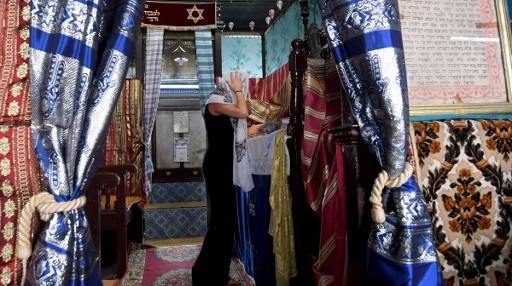 A French pilgrim prays at the Ghriba synagogue in the Tunisian resort island of Djerba on May 12, 2017 during the first day of the annual Jewish pilgrimage to the synagogue on Tunisia's Mediterranean resort island of Djerba. (Fethi Belad/AFP)