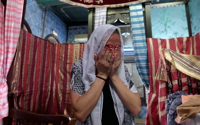 A French pilgrim prays at the Ghriba synagogue in the Tunisian resort island of Djerba on May 12, 2017 during the first day of the annual Jewish pilgrimage to the synagogue on Tunisia's Mediterranean resort island of Djerba. (Fethi Belad/AFP) A French pilgrim prays at the Ghriba synagogue in the Tunisian resort island of Djerba on May 12, 2017 during the first day of the annual Jewish pilgrimage to the synagogue on Tunisia's Mediterranean resort island of Djerba. (Fethi Belad/AFP)
