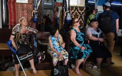 Four French-Tunisian sisters 79-year-old Fortunee (L), 87-year-old Henriette (CL), 82-year-old Eliane (CR) and 67-year-old Odette (R) visit the Ghriba synagogue in the Tunisian resort island of Djerba on May 12, 2017 as they participate in their annual pilgrimage to the synagogue on Tunisia's Mediterranean resort island of Djerba. (Fethi Belaid/AFP)