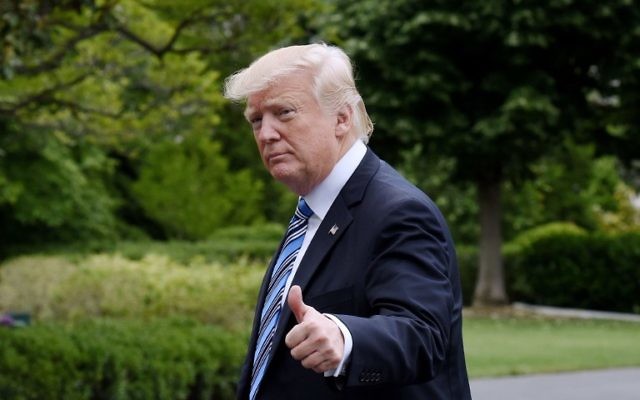 US President Donald Trump exits Marine One on the South Lawn of the White House in Washington, DC, May 13, 2017. (AFP/Olivier Douliery)