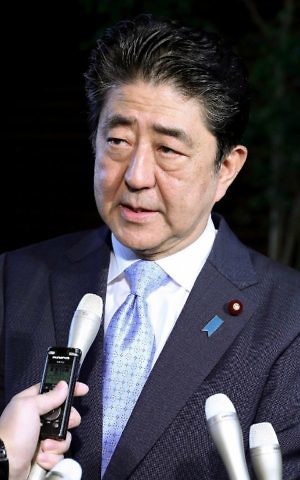 Japan's Prime Minister Shinzo Abe speaks to journalists at his official residence in Tokyo on May 14, 2017. (AFP Photo/JIJI Press/STR)