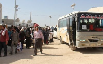 Syrian civilians and rebels, who were evacuated from the Qabun district in northeast Damascus, arrive at a temporary camp in the northern countryside of Idlib province on May 15, 2017. (AFP/Omar Haj Kadour)