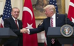 US President Donald Trump shakes hands with Turkish President Recep Tayyip Erdogan after speaking to the press in the Roosevelt Room of the White House on May 16, 2017. (AFP/ Saul Loeb/ File)