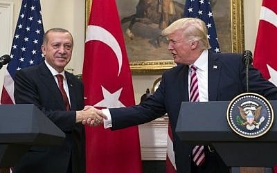 US President Donald Trump shakes hands with Turkish President Recep Tayyip Erdogan after speaking to the press in the Roosevelt Room of the White House on May 16, 2017. (AFP/ Saul Loeb/ File)