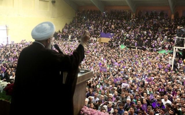 Iranian president and candidate in the upcoming presidential elections Hassan Rouhani speaks during a campaign rally in the northwestern city of Ardabil on May 17, 2017. (AFP Photo/Behrouz Mehri)