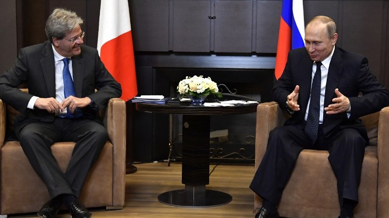 Russian President Vladimir Putin (R) meets with Italian Prime Minister Paolo Gentiloni at the Bocharov Ruchei state residence in Sochi on May 17, 2017. (AFP Photo/Pool/Yuri Kadobnov) Russian President Vladimir Putin (R) meets with Italian Prime Minister Paolo Gentiloni at the Bocharov Ruchei state residence in Sochi on May 17, 2017. (AFP Photo/Pool/Yuri Kadobnov)