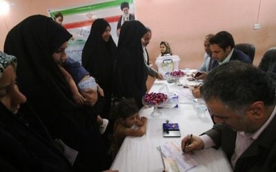 Iranians queue to cast their ballots during Iran's 12th presidential election at the Consulate General of Iran in the southern Iraqi city of Basra, on May 19, 2017. (Haidar Mohammed Ali/AFP)