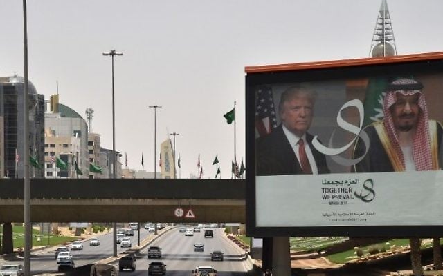 A giant billboard bearing portraits of US President Donald Trump and Saudi Arabia's King Salman, is seen on a main road in Riyadh, on May 19, 2017. (AFP PHOTO / GIUSEPPE CACACE) A giant billboard bearing portraits of US President Donald Trump and Saudi Arabia's King Salman, is seen on a main road in Riyadh, on May 19, 2017. (AFP PHOTO / GIUSEPPE CACACE)