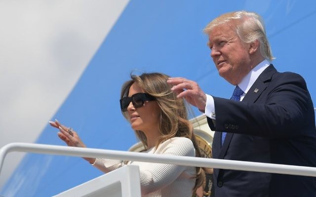 US President Donald Trump and First Lady Melania Trump make their way to board Air Force One before departing from Andrews Air Force Base in Maryland on May 19, 2017. (MANDEL NGAN / AFP) US President Donald Trump and First Lady Melania Trump make their way to board Air Force One before departing from Andrews Air Force Base in Maryland on May 19, 2017. (MANDEL NGAN / AFP)
