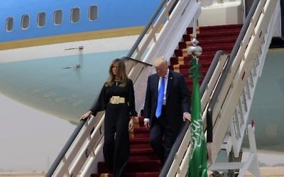 US President Donald Trump and First Lady Melania Trump step off Air Force One upon arriving at King Khalid International Airport in Riyadh on May 20, 2017. (AFP Photo/Mandel Ngan)