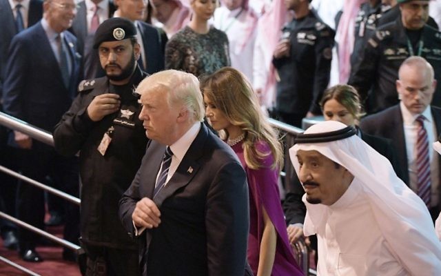 US President Donald Trump (C) and Saudi Arabia's King Salman bin Abdulaziz al-Saud (R) take part in a welcome ceremony ahead of a banquet at Murabba Palace in Riyadh on May 20, 2017. (AFP PHOTO / MANDEL NGAN) US President Donald Trump (C) and Saudi Arabia's King Salman bin Abdulaziz al-Saud (R) take part in a welcome ceremony ahead of a banquet at Murabba Palace in Riyadh on May 20, 2017. (AFP PHOTO / MANDEL NGAN)