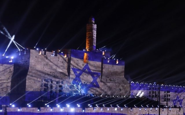 An audio slideshow is projected on the ancient walls of Jerusalem's Old City on May 20, 2017, on the beginning of the week marking the 50th anniversary of the 1967 Israeli-Arab War. ( AFP PHOTO / GALI TIBBON)
