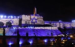 An audio slideshow is projected on the ancient walls of Jerusalem's Old City on May 20, 2017, on the beginning of the week marking the 50th anniversary of the 1967 Six Day War. (AFP Photo/Gali Tibbon)