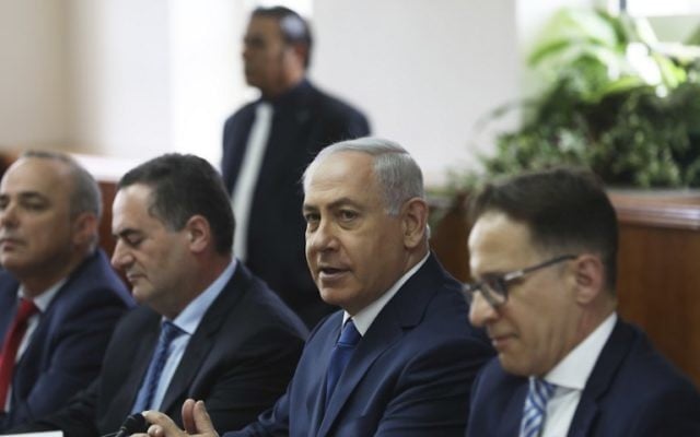 Prime Minister Benjamin Netanyahu (second from right) hosts his weekly cabinet meeting in Jerusalem May 21, 2017. (AFP Photo/Pool/Ronen Zvulun) Prime Minister Benjamin Netanyahu (second from right) hosts his weekly cabinet meeting in Jerusalem May 21, 2017. (AFP Photo/Pool/Ronen Zvulun)