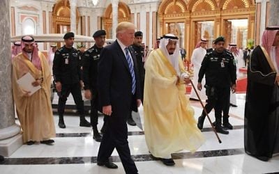 US President Donald Trump (C-L) and Saudi Arabia's King Salman bin Abdulaziz al-Saud (C-R) arrive for the Arabic Islamic American Summit at the King Abdulaziz Conference Center in Riyadh on May 21, 2017 (AFP PHOTO / MANDEL NGAN)