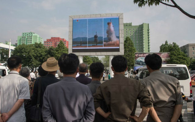 People watch a screen showing news coverage of the Pukguksong-2 missile rocket launch at a public square in central Pyongyang on May 22, 2017. (Kim Won-Jin/AFP) People watch a screen showing news coverage of the Pukguksong-2 missile rocket launch at a public square in central Pyongyang on May 22, 2017. (Kim Won-Jin/AFP)