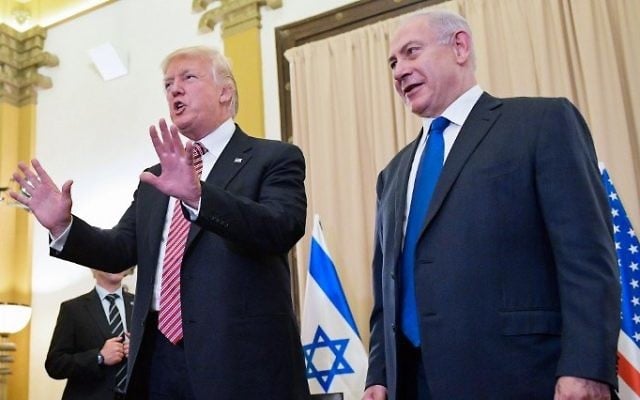 Then-US president Donald Trump, left, reacts to a reporter's question ahead of a meeting with Prime Minister Benjamin Benjamin Netanyahu, right, at the King David Hotel in Jerusalem on May 22, 2017. (AFP/Mandel Ngan) Then-US president Donald Trump, left, reacts to a reporter's question ahead of a meeting with Prime Minister Benjamin Benjamin Netanyahu, right, at the King David Hotel in Jerusalem on May 22, 2017. (AFP/Mandel Ngan)