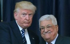 US President Donald Trump, left, and Palestinian leader Mahmoud Abbas pose for a photograph during a joint press conference at the presidential palace in the West Bank city of Bethlehem, on May 23, 2017. (AFP/Mandel Ngan)