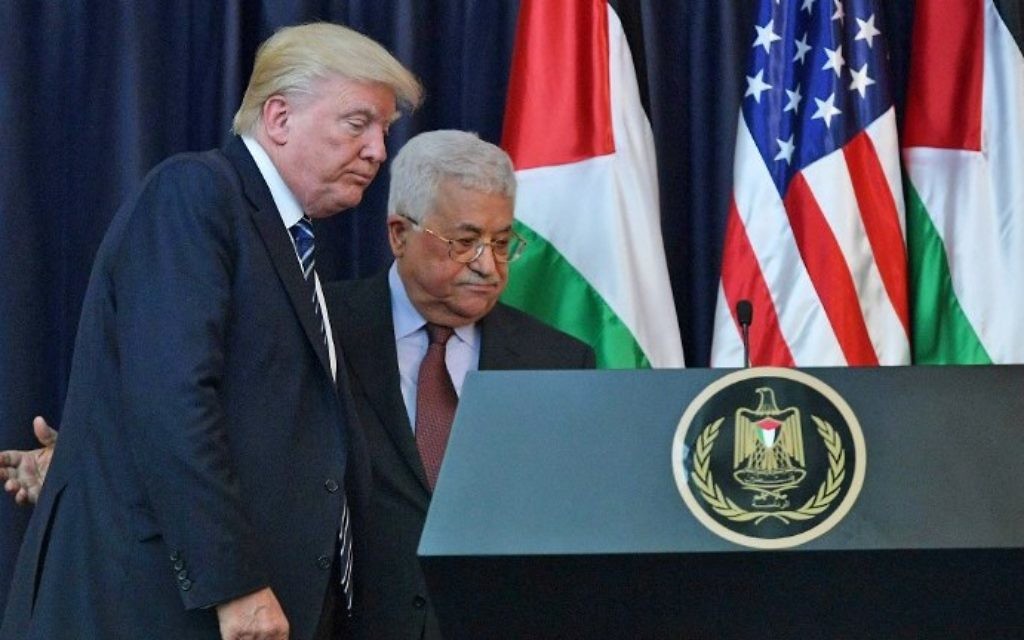 US President Donald Trump (L) and PA President Mahmoud Abbas leave following a joint press conference at the presidential palace in the West Bank city of Bethlehem on May 23, 2017. (AFP/Mandel Ngan) US President Donald Trump (L) and PA President Mahmoud Abbas leave following a joint press conference at the presidential palace in the West Bank city of Bethlehem on May 23, 2017. (AFP/Mandel Ngan)