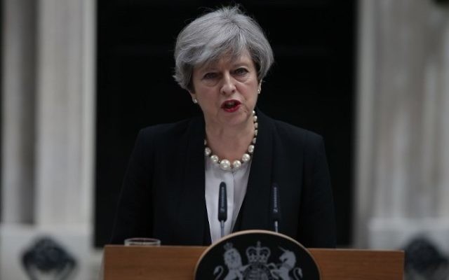 The day after a a deadly suicide bombing in the northern city of Manchester, Britain's Prime Minister Theresa May delivers a statement outside 10 Downing Street in central London after an emergency meeting of the Cobra committee, May 23, 2017. (AFP/Daniel LEAL-OLIVAS) The day after a a deadly suicide bombing in the northern city of Manchester, Britain's Prime Minister Theresa May delivers a statement outside 10 Downing Street in central London after an emergency meeting of the Cobra committee, May 23, 2017. (AFP/Daniel LEAL-OLIVAS)