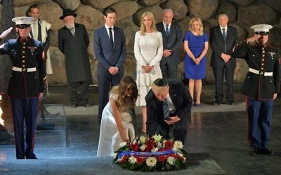 US President Donald Trump (C-R) and First Lady Melania Trump (C-L) lay a wreath during a visit to the Yad Vashem Holocaust Memorial museum on May 23, 2017, in Jerusalem. (MANDEL NGAN / AFP)