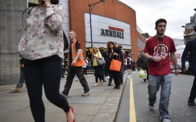People leave the Arndale Centre as the shopping mall is evacuated in Manchester, northwest England, following a security alert, May 23, 2017. (AFP/Ben STANSALL) People leave the Arndale Centre as the shopping mall is evacuated in Manchester, northwest England, following a security alert, May 23, 2017. (AFP/Ben STANSALL)