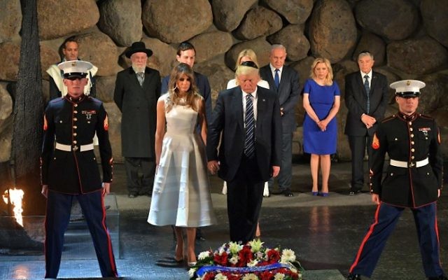 US President Donald Trump (C-R) and First Lady Melania Trump (C-L) lay a wreath during a visit to the Yad Vashem Holocaust Memorial museum, on May 23, 2017, in Jerusalem. (MANDEL NGAN / AFP) US President Donald Trump (C-R) and First Lady Melania Trump (C-L) lay a wreath during a visit to the Yad Vashem Holocaust Memorial museum, on May 23, 2017, in Jerusalem. (MANDEL NGAN / AFP)
