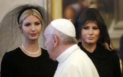 Pope Francis (C) walks past US First Lady Melania Trump (R) and the daughter of US President Donald Trump Ivanka Trump (L) at the end of a private audience at the Vatican on May 24, 2017 (AFP PHOTO / POOL / Alessandra Tarantino)