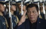 Philippine President Rodrigo Duterte walks past honor guards as he arrives at Manila international airport in Manila on May 24, 2017. (AFP/Noel Celis)