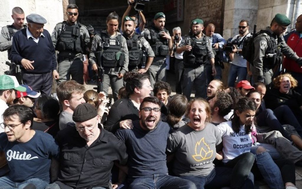 Activists protest outside Damascus Gate in Jerusalem's Old City on May 24, 2017, ahead of the annual Jerusalem Day march. (AFP Photo/Thomas Coex)