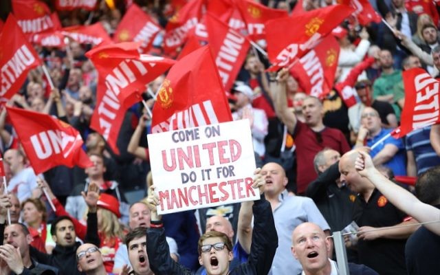 Supporters of Manchester United cheer prior to the UEFA Europa League final football match Ajax Amsterdam v Manchester United on May 24, 2017 at the Friends Arena in Solna outside Stockholm. (AFP/ SOREN ANDERSSON)
