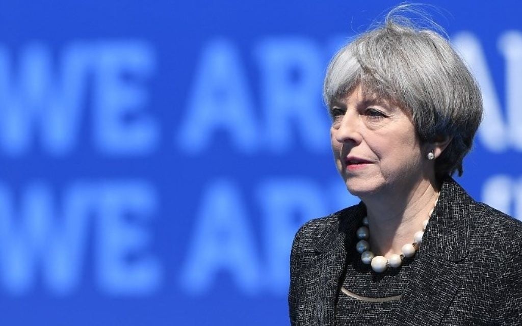 Britain's Prime Minister Theresa May arrives for the NATO (North Atlantic Treaty Organization) summit at the NATO headquarters, in Brussels, on May 25, 2017. (AFP PHOTO / Emmanuel DUNAND)