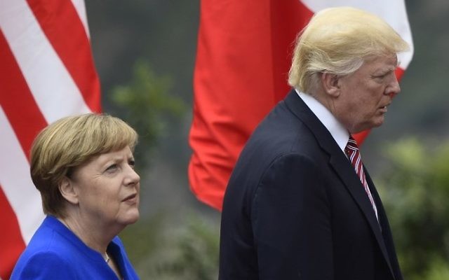 US President Donald Trump and German Chancellor Angela Merkel arrive for a photo during the G7 summit in Taormina, Sicily, on May 26, 2017. (AFP Photo/Miguel Medina) US President Donald Trump and German Chancellor Angela Merkel arrive for a photo during the G7 summit in Taormina, Sicily, on May 26, 2017. (AFP Photo/Miguel Medina)
