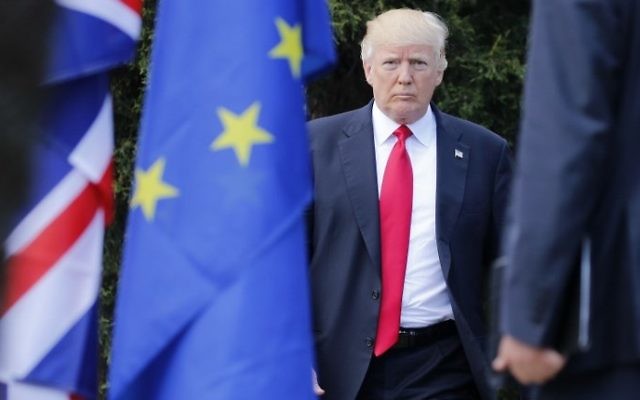 US President Donald Trump arrives for a family photo with leaders of the G7 and leaders of some African countries that have been invited for the two-day talks, on the second day of the G7 summit of Heads of State and of Government, on May 27, 2017 in Taormina, Sicily. (AFP PHOTO / POOL / JONATHAN ERNST)