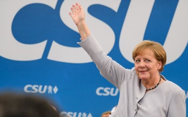 German Chancellor Angela Merkel waves after delivering a speech during a joint campaigning event of the Christian Democratic Union (CDU) and the Christian Social Union (CSU) in Munich, southern Germany, on May 27, 2017. (AFP PHOTO / dpa / Matthias Balk) German Chancellor Angela Merkel waves after delivering a speech during a joint campaigning event of the Christian Democratic Union (CDU) and the Christian Social Union (CSU) in Munich, southern Germany, on May 27, 2017. (AFP PHOTO / dpa / Matthias Balk)