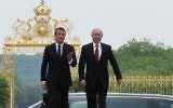 File: French President Emmanuel Macron (L) and his Russian counterpart Vladimir Putin arrive at the Palace of Versailles, near Paris, as they meet for talks on May 29, 2017. (AFP Photo/Pool/Francois Mori)
