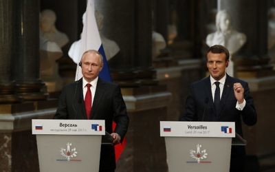 French President Emmanuel Macron, right, delivers a joint press conference with Russian President Vladimir Putin following their meeting at the Versailles Palace, near Paris, May 29, 2017. (AFP/GEOFFROY VAN DER HASSELT)
