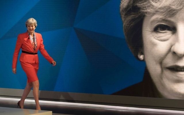 British Prime Minister Theresa May walks out to take part in the 'May v Corbyn Live: The Battle for Number 10,' Sky News and Channel 4 event in at Sky Studios in London, May 29, 2017. (AFP/POOL/Stefan ROUSSEAU)
