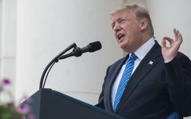 This file photo taken on May 29, 2017 shows US President Donald Trump speaking at Arlington National Cemetery to mark Memorial Day in Arlington, Virginia. (AFP Photo/Nicholas Kamm)