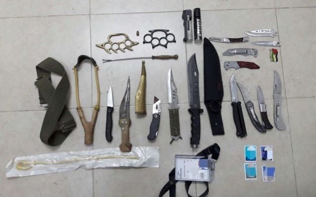 Knives and assorted weaponry found by the IDF during a raid in the West Bank city of Hebron on May 8, 2017. (IDF Spokesperson's Unit) Knives and assorted weaponry found by the IDF during a raid in the West Bank city of Hebron on May 8, 2017. (IDF Spokesperson's Unit)