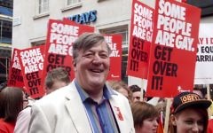 Stephen Fry pictured at a 2012 Pride Parade in London (Photograph at WorldPride / Wikipedia)