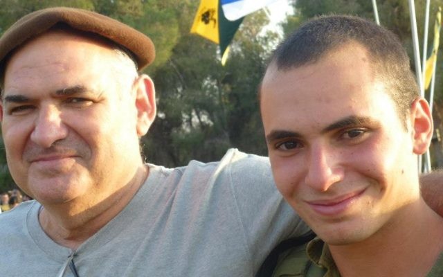 Avi Yacoby, left, poses for a photograph with his son Gilad, who later fell in the 2014 Gaza war. (Courtesy)