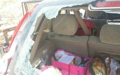 An Israeli car that was attacked by Palestinian rock throwers on Thursday, May 18, 2017, in the West Bank village of Hawara (Regavim) An Israeli car that was attacked by Palestinian rock throwers on Thursday, May 18, 2017, in the West Bank village of Hawara (Regavim)