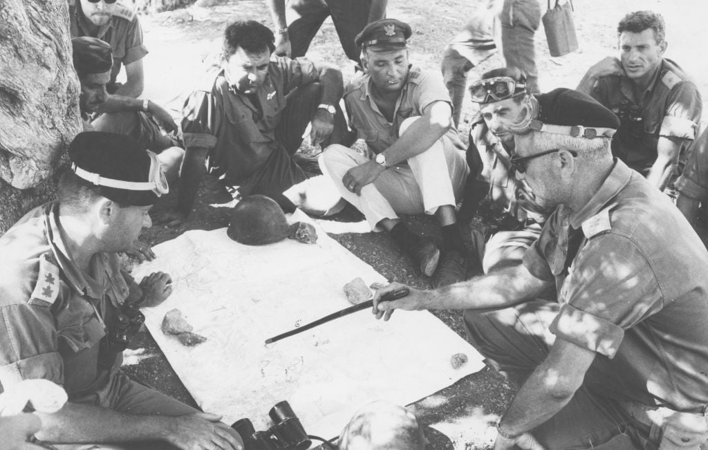 The head of the IDF's Harel Brigade Col. Uri Ben-Ari briefs his commanders on the outskirts of Jerusalem on June 1, 1967. (Defense Ministry's IDF Archive) The head of the IDF's Harel Brigade Col. Uri Ben-Ari briefs his commanders on the outskirts of Jerusalem on June 1, 1967. (Defense Ministry's IDF Archive)