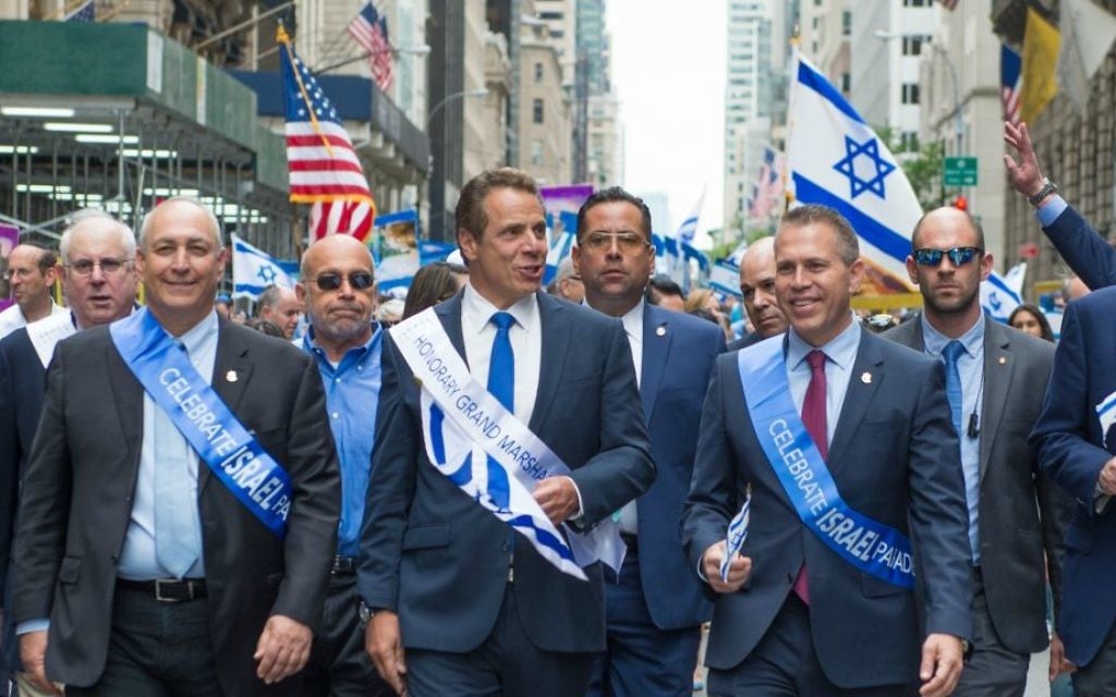 Strategic Affairs Minister Gilad Erdan, center-right, marches in the Celebrate Israel Parade on Sunday, June 4, 2017. New York Governor Andrew Cuomo, center, was an honorary grand marshal. (Alexi Rosenfeld) Strategic Affairs Minister Gilad Erdan, center-right, marches in the Celebrate Israel Parade on Sunday, June 4, 2017. New York Governor Andrew Cuomo, center, was an honorary grand marshal. (Alexi Rosenfeld)