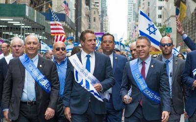 Strategic Affairs Minister Gilad Erdan, center-right, marches in the Celebrate Israel Parade on Sunday, June 4, 2017. New York Governor Andrew Cuomo, center, was an honorary grand marshal. (Alexi Rosenfeld)