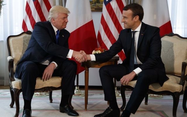 US President Donald Trump shakes hands with French President Emmanuel Macron during a meeting at the US Embassy, Thursday, May 25, 2017, in Brussels. (AP/Evan Vucci)
