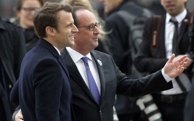 French President-elect Emmanuel Macron, left, and outgoing President Francois Hollande attend a ceremony to mark the end of World War II at the Arc de Triomphe in Paris, Monday, May 8, 2017. (Philippe Wojazer, Pool via AP)